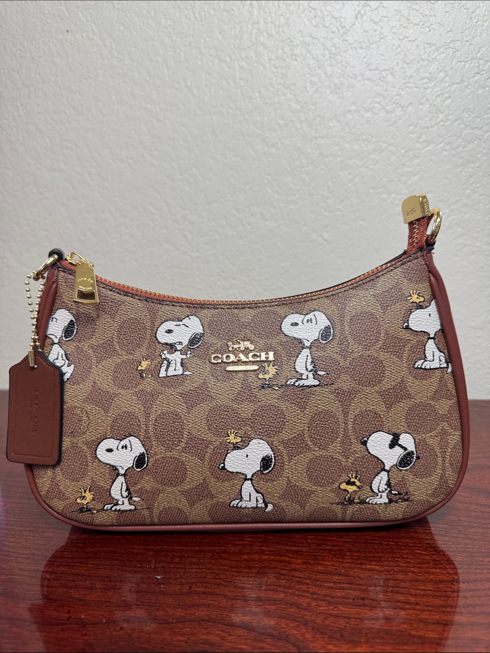 Coach Teri Peanuts Brown Snoopy Print Mini Shoulder Bag.